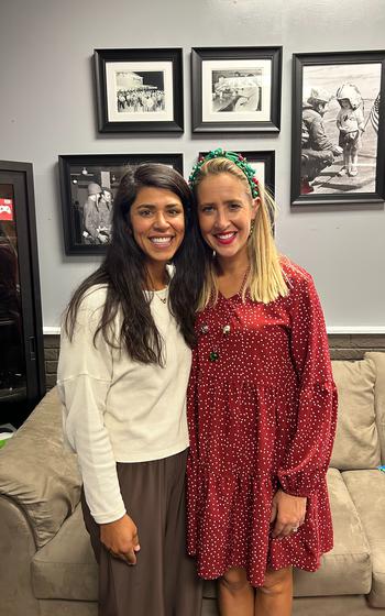 Two ladies posing for a photo.
